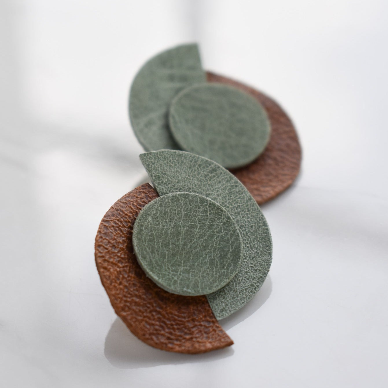 Handmade, light weight and comfortable to wear all day long leather earrings. All our earring hooks are made with a high quality stainless steel and they are hypo allergenic. They will not tarnish or irritate your sensitive skin.