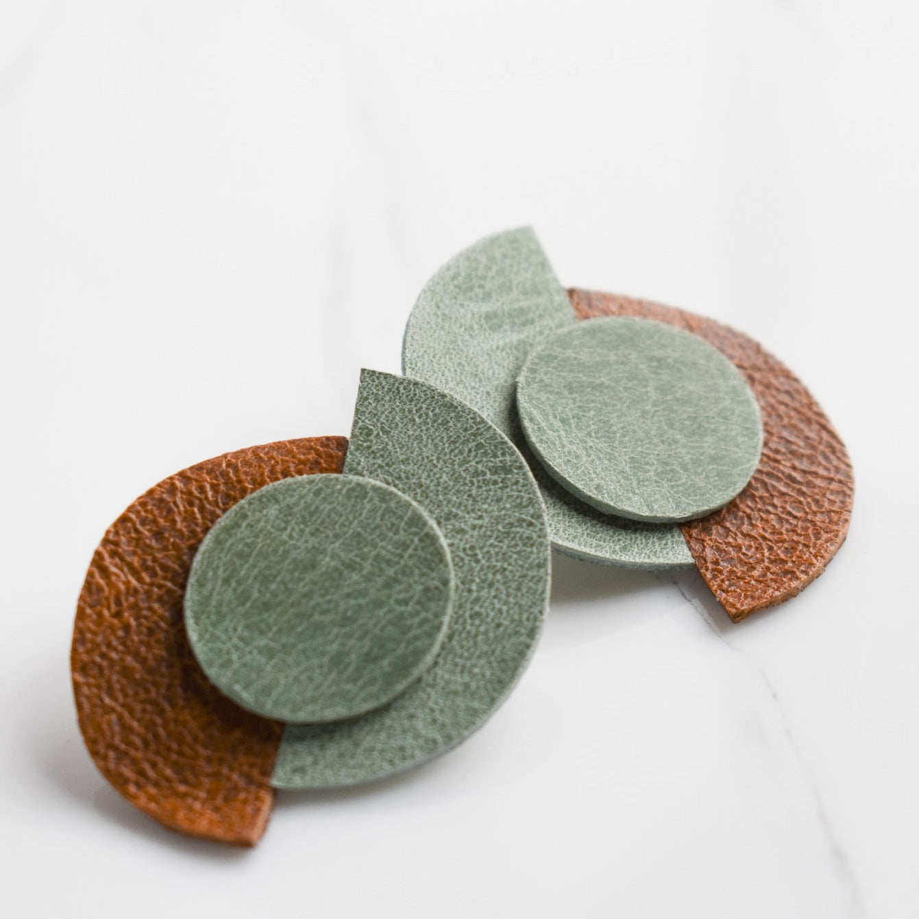 Handmade, light weight and comfortable to wear all day long leather earrings. All our earring hooks are made with a high quality stainless steel and they are hypo allergenic. They will not tarnish or irritate your sensitive skin.