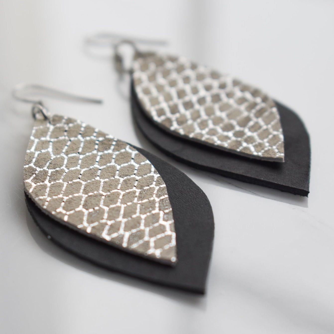 Handmade, light weight and comfortable to wear all day long leather earrings. All our earring hooks are made with a high quality stainless steel and they are hypo allergenic. They will not tarnish or irritate your sensitive skin.