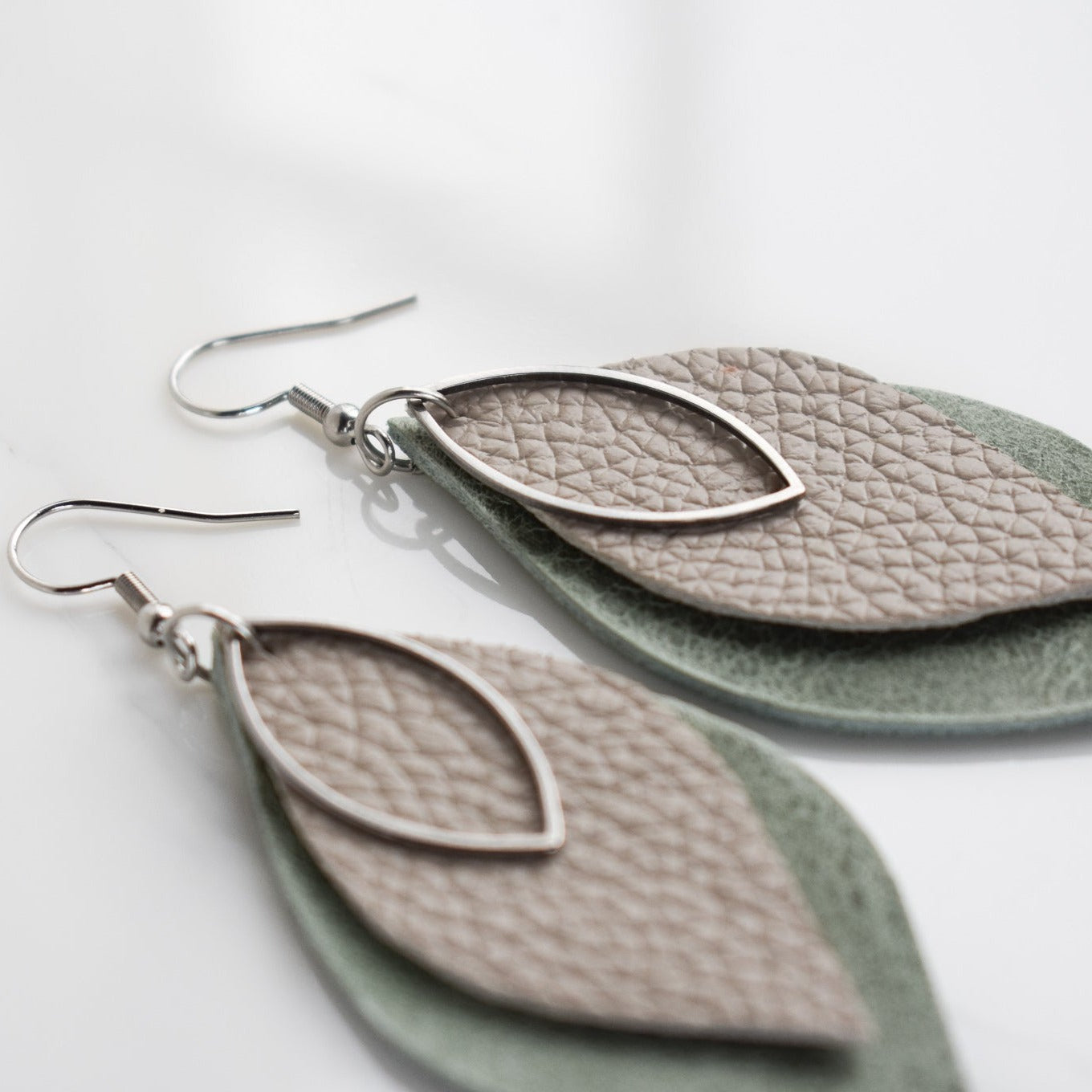 Handmade, light weight and comfortable to wear all day long leather earrings. All our earring hooks are made with a high quality stainless steel and they are hypo allergenic. They will not tarnish or irritate your sensitive skin.