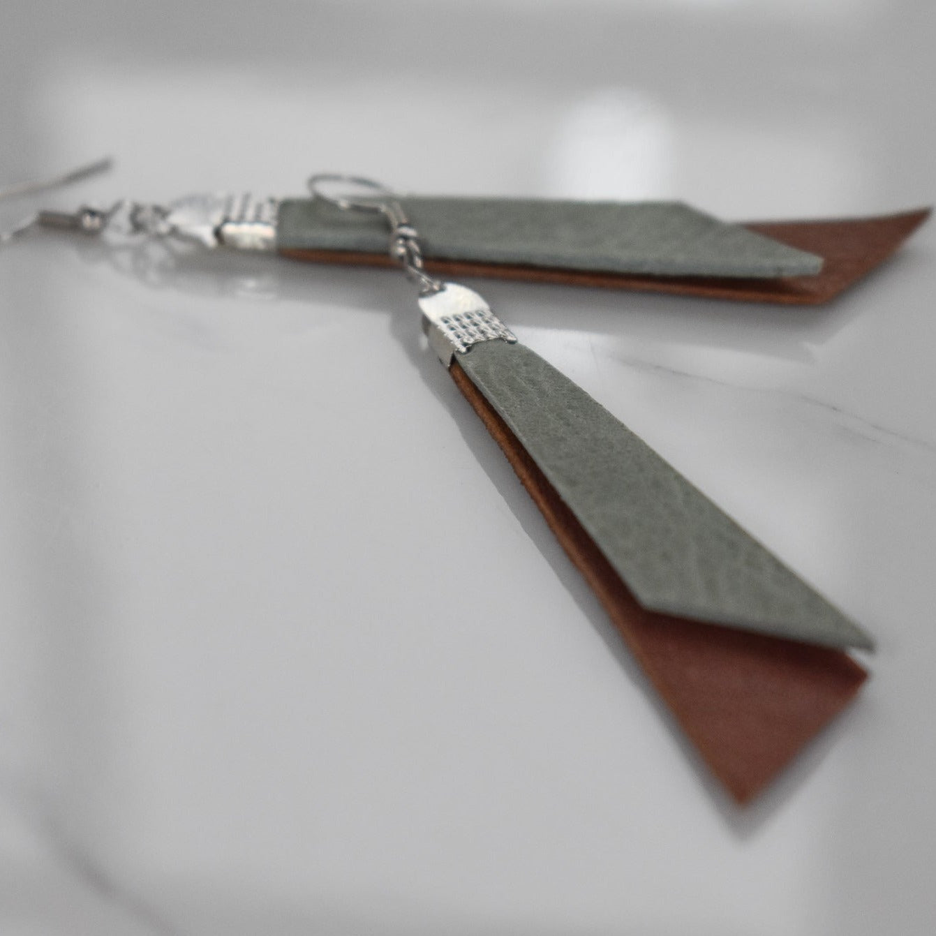 Handmade, light weight and comfortable to wear all day long leather earrings. All our earring hooks are made with a high quality stainless steel and they are hypo allergenic. They will not tarnish or irritate your sensitive skin.