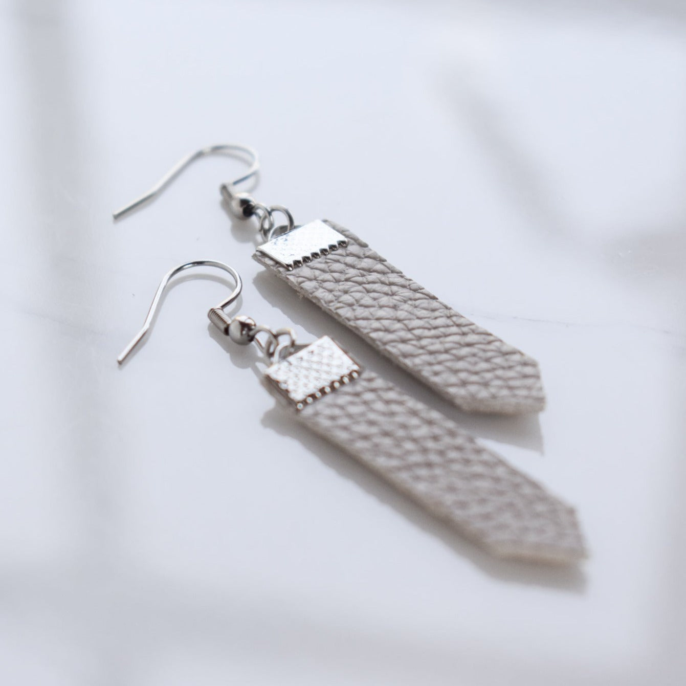Handmade, light weight and comfortable to wear all day long leather earrings. All our earring hooks are made with a high quality stainless steel and they are hypo allergenic. They will not tarnish or irritate your sensitive skin.