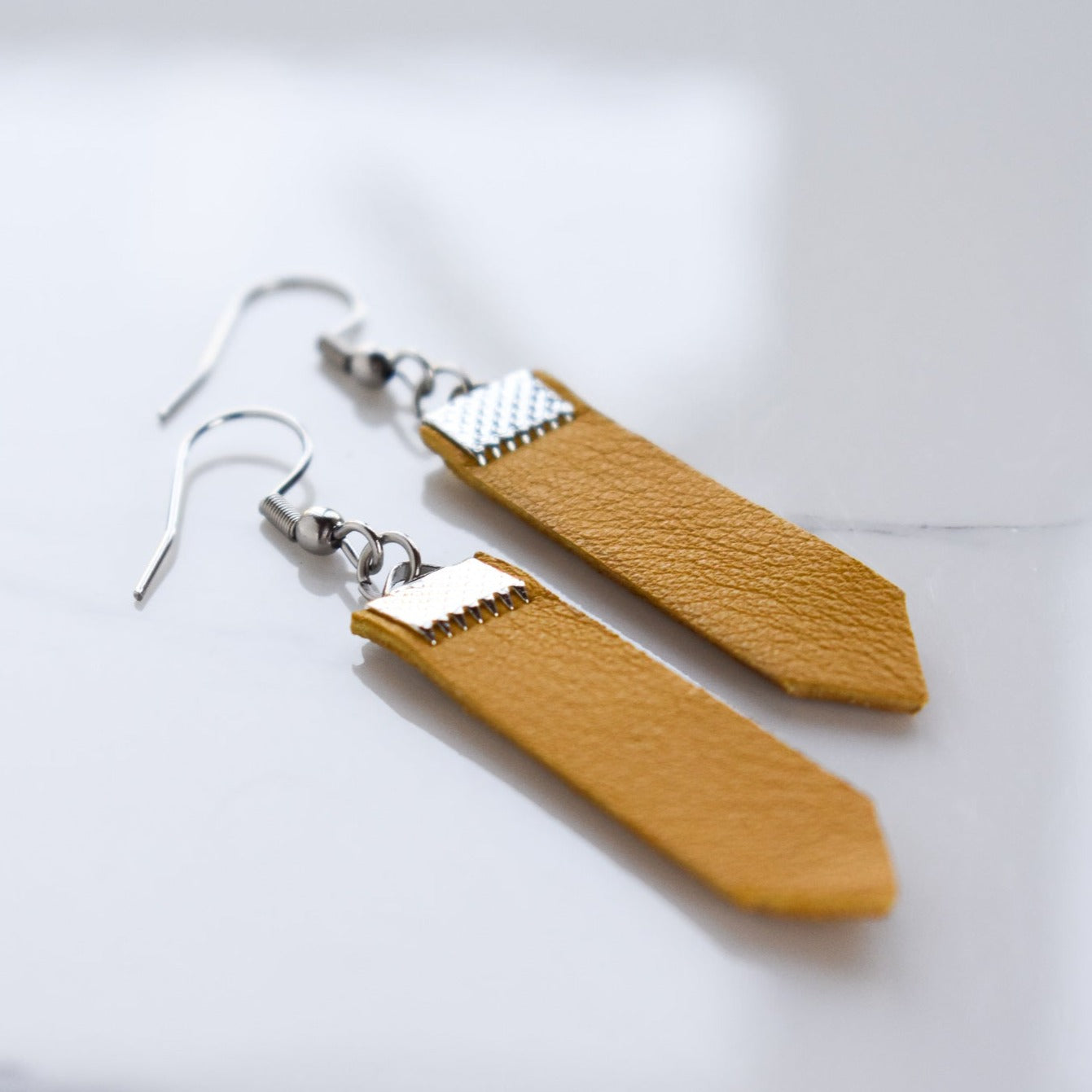 Handmade, light weight and comfortable to wear all day long leather earrings. All our earring hooks are made with a high quality stainless steel and they are hypo allergenic. They will not tarnish or irritate your sensitive skin.