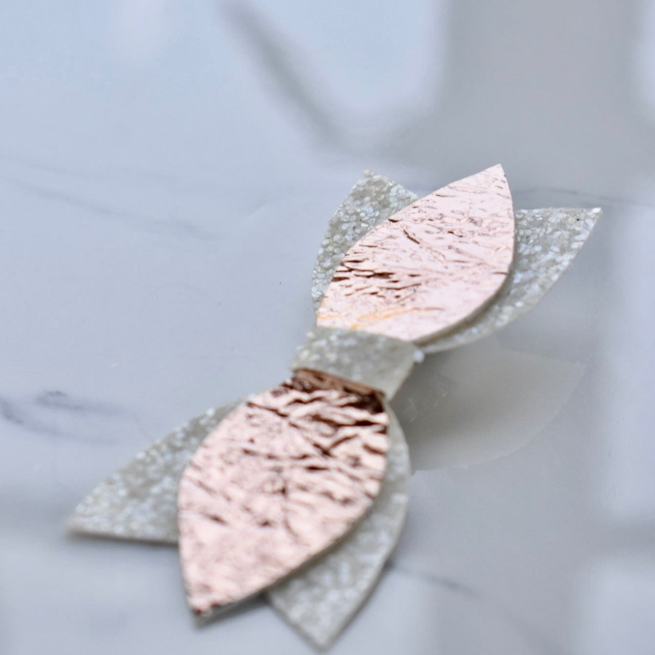 Handmade, bow style hair clip. Also customisable.