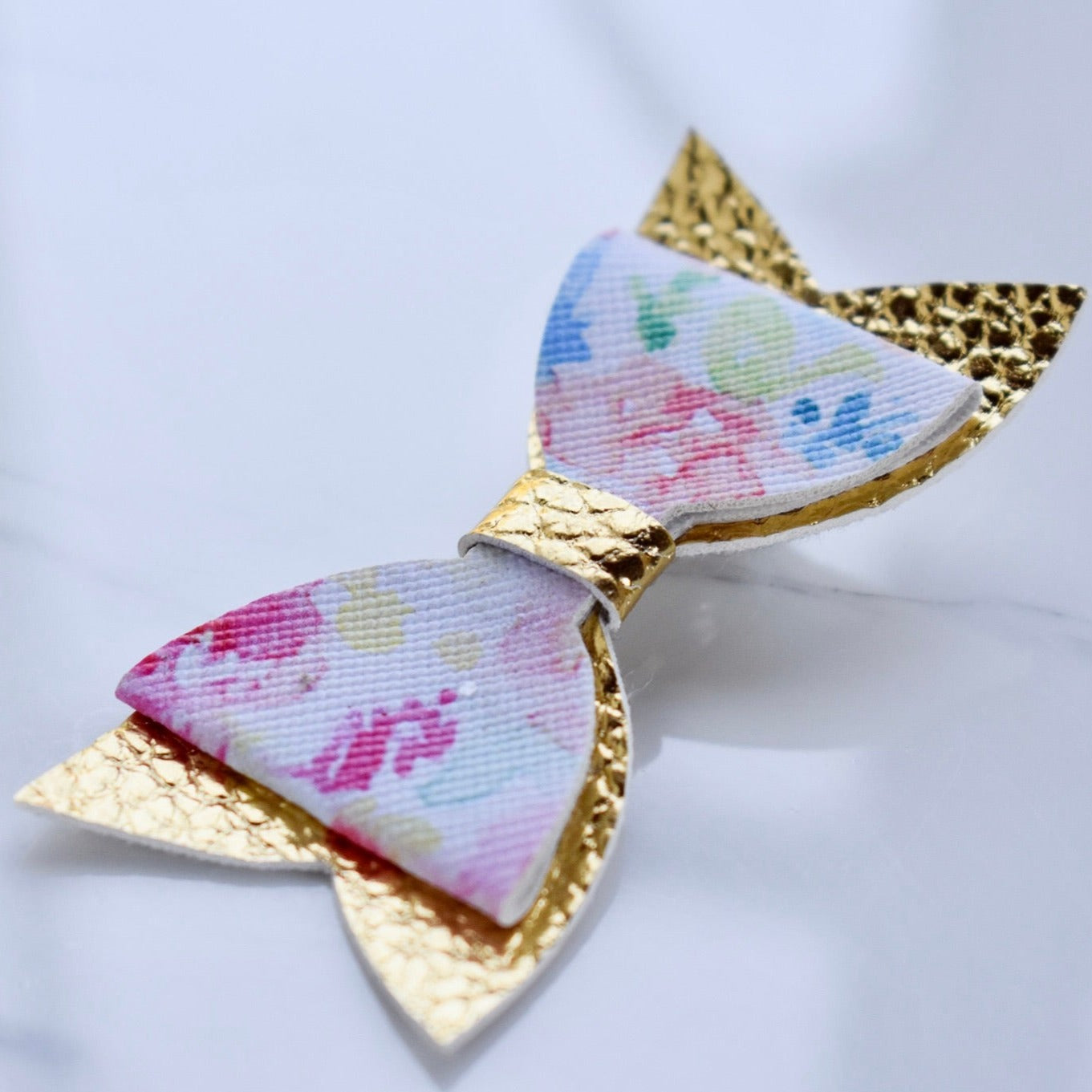 Handmade, bow style hair clip. Also customisable.