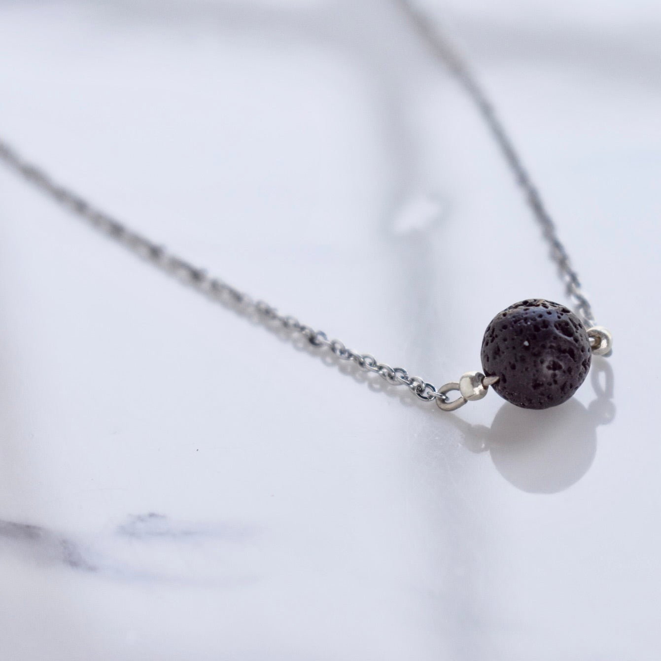 Beautifully handcrafted stainless steel necklace with a lava bead. Add a drop of your favourite essential oil or perfume on your lava bead for a personal diffuser.