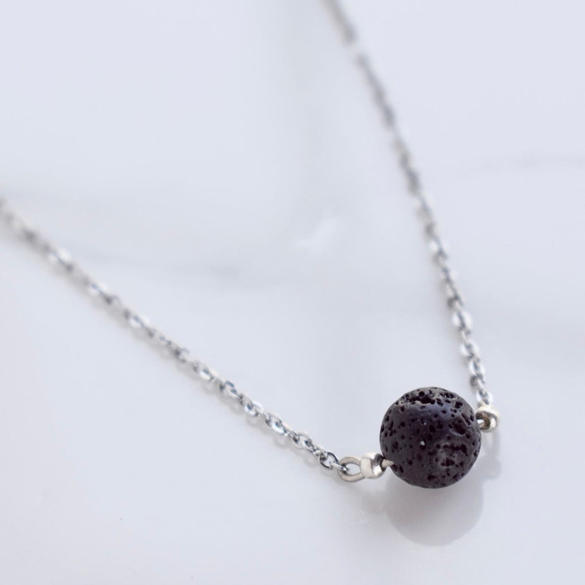 Beautifully handcrafted stainless steel necklace with a lava bead. Add a drop of your favourite essential oil or perfume on your lava bead for a personal diffuser.