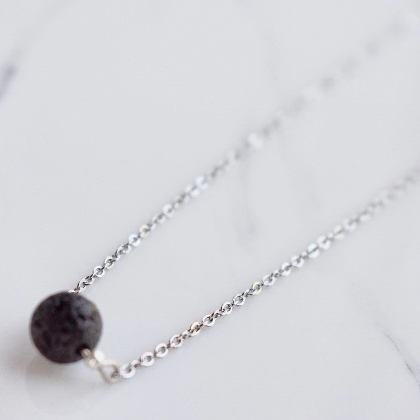 Beautifully handcrafted stainless steel necklace with a lava bead. Add a drop of your favourite essential oil or perfume on your lava bead for a personal diffuser.