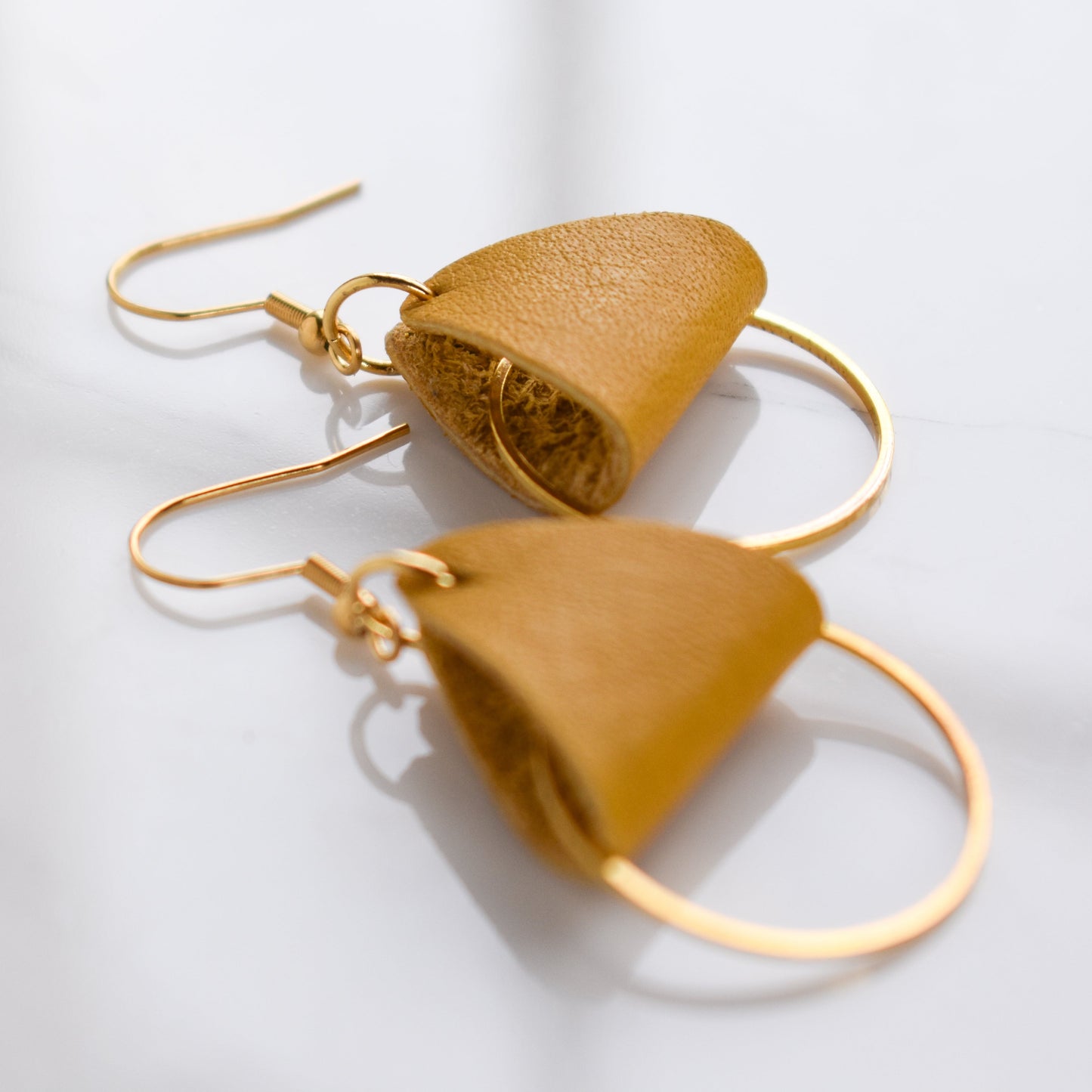 Handmade, light weight and comfortable to wear all day long leather earrings. All our earring hooks are made with a high quality stainless steel and they are hypo allergenic. They will not tarnish or irritate your sensitive skin.