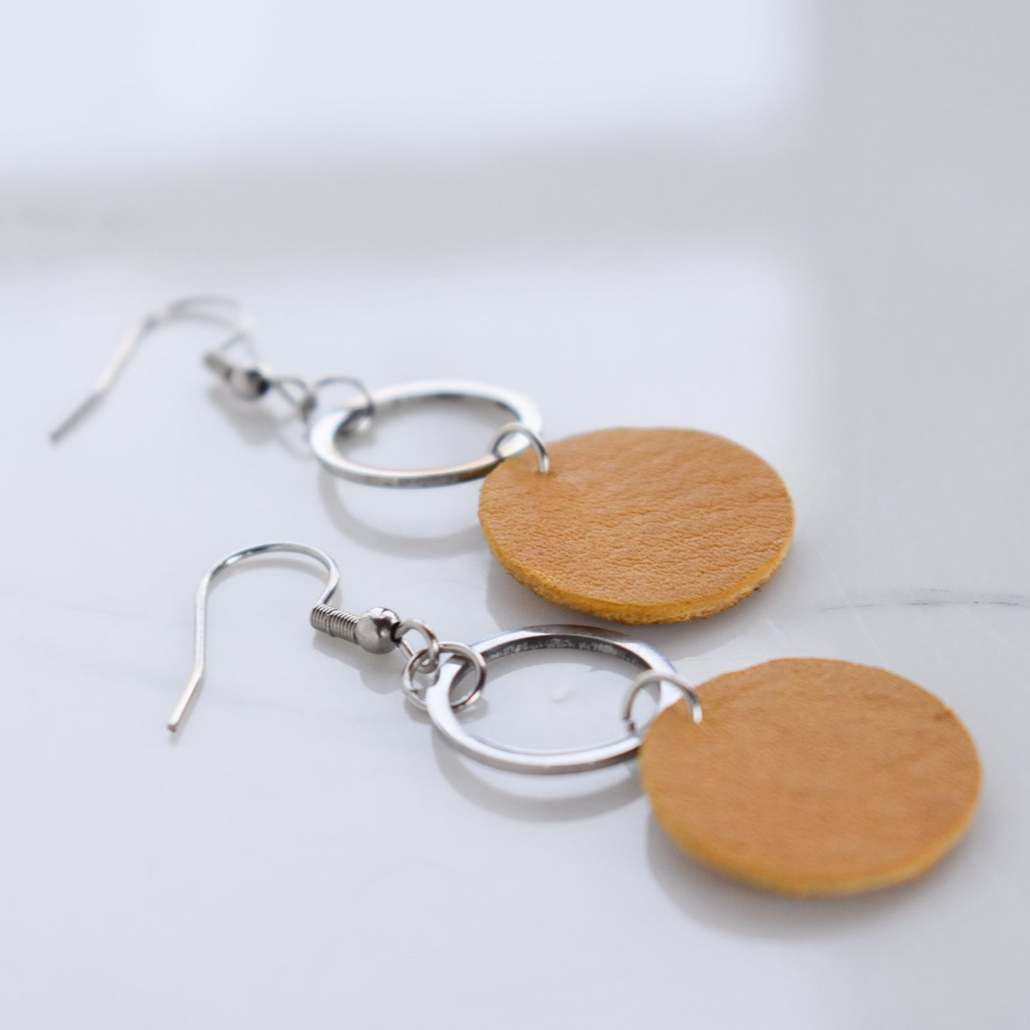 Handmade, light weight and comfortable to wear all day long leather earrings. All our earring hooks are made with a high quality stainless steel and they are hypo allergenic. They will not tarnish or irritate your sensitive skin.