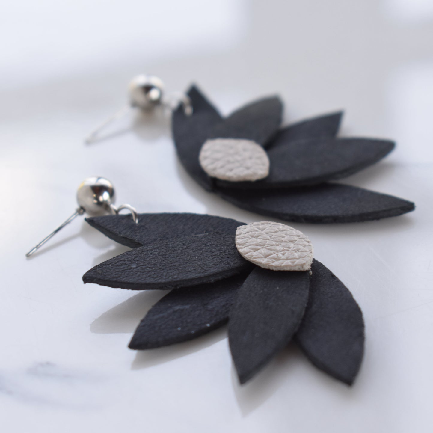 Handmade, light weight and comfortable to wear all day long leather earrings. All our earring hooks are made with a high quality stainless steel and they are hypo allergenic. They will not tarnish or irritate your sensitive skin.
