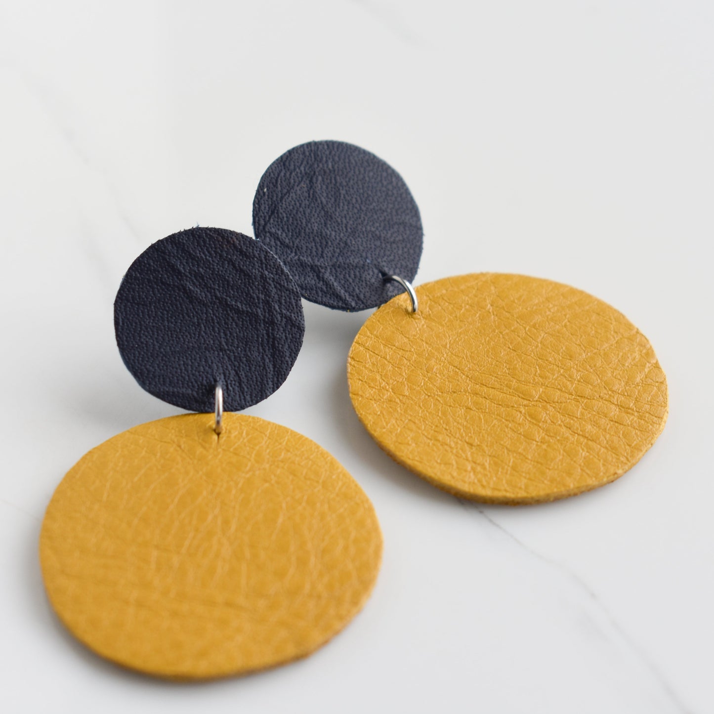 Handmade, light weight and comfortable to wear all day long leather earrings. All our earring hooks are made with a high quality stainless steel and they are hypo allergenic. They will not tarnish or irritate your sensitive skin.