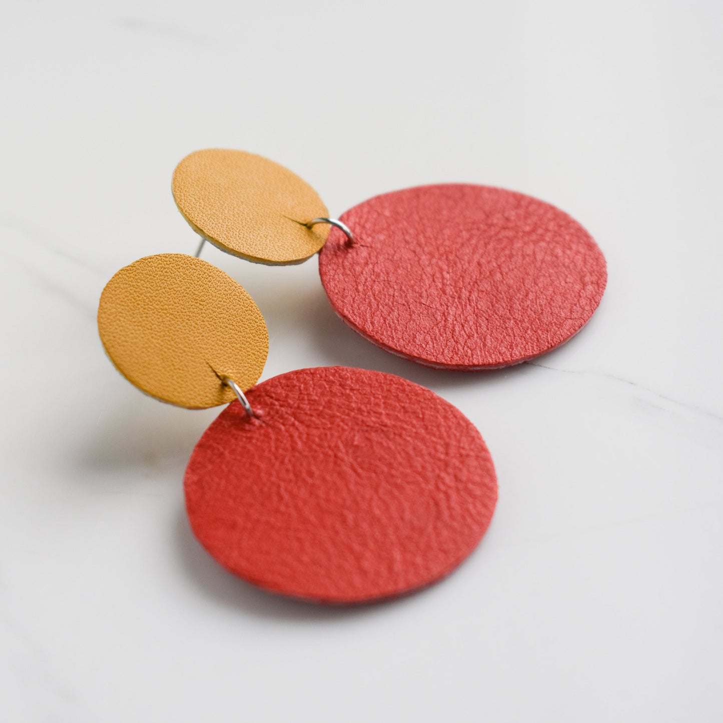 Handmade, light weight and comfortable to wear all day long leather earrings. All our earring hooks are made with a high quality stainless steel and they are hypo allergenic. They will not tarnish or irritate your sensitive skin.