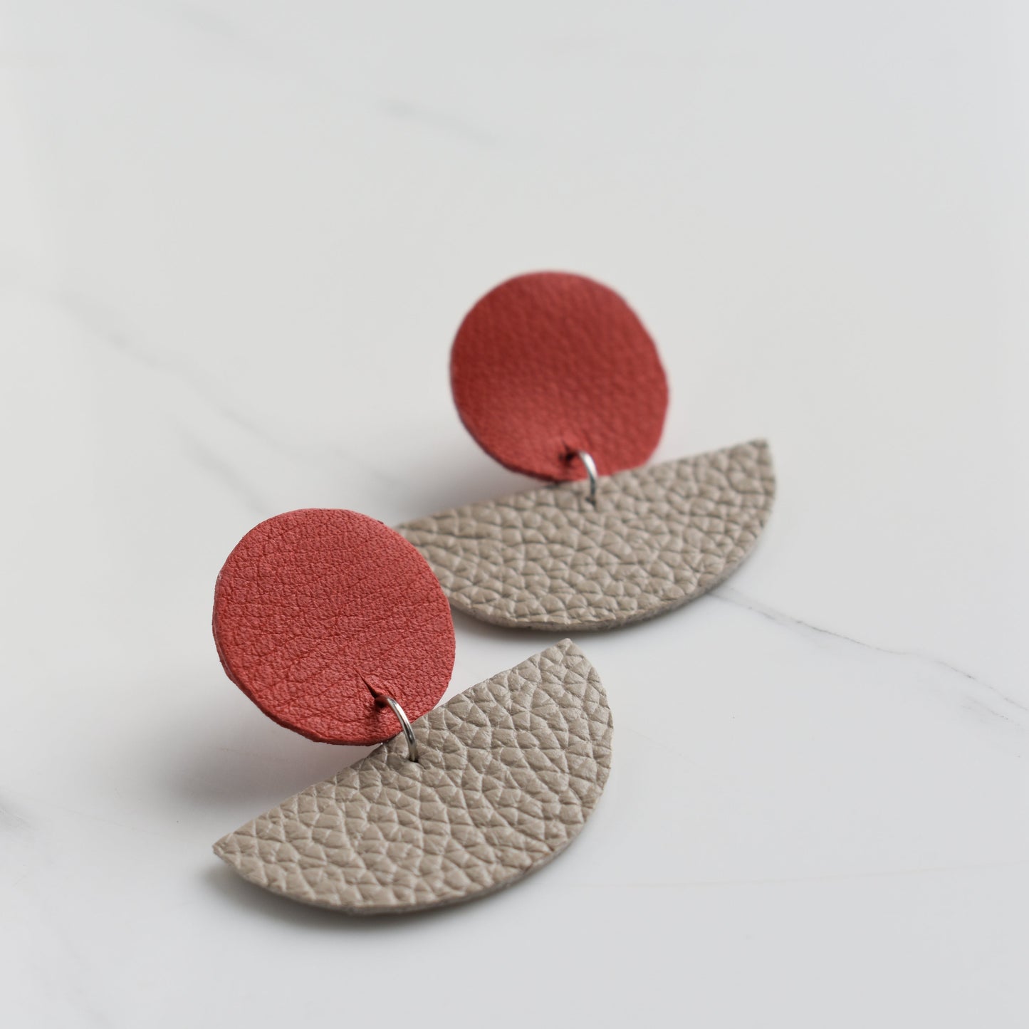 Handmade, light weight and comfortable to wear all day long leather earrings. All our earring hooks are made with a high quality stainless steel and they are hypo allergenic. They will not tarnish or irritate your sensitive skin.