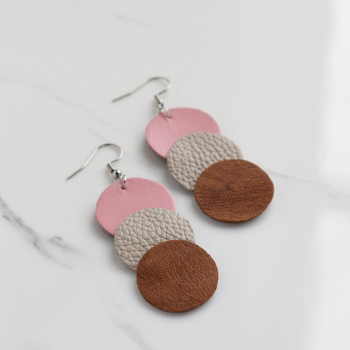 Handmade, light weight and comfortable to wear all day long leather earrings. All our earring hooks are made with a high quality stainless steel and they are hypo allergenic. They will not tarnish or irritate your sensitive skin.