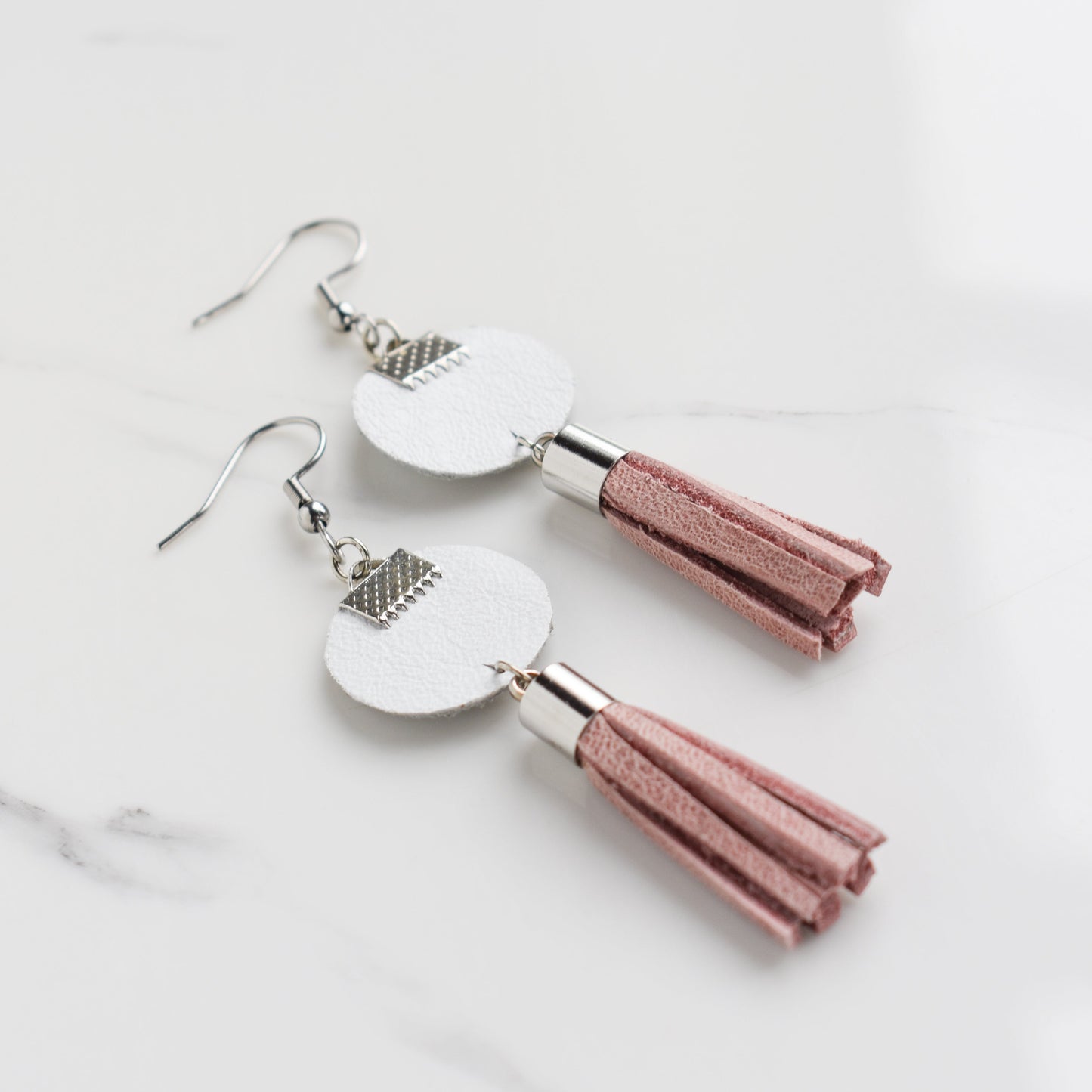 Handmade, light weight and comfortable to wear all day long leather earrings. All our earring hooks are made with a high quality stainless steel and they are hypo allergenic. They will not tarnish or irritate your sensitive skin.