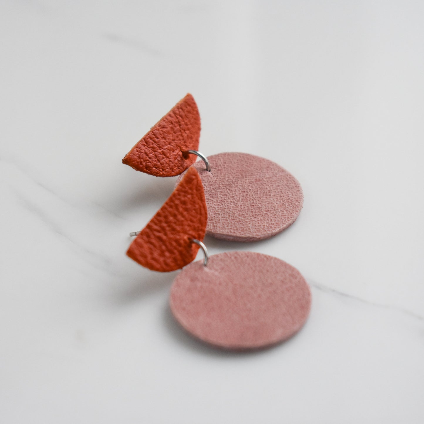 Handmade, light weight and comfortable to wear all day long leather earrings. All our earring hooks are made with a high quality stainless steel and they are hypo allergenic. They will not tarnish or irritate your sensitive skin.