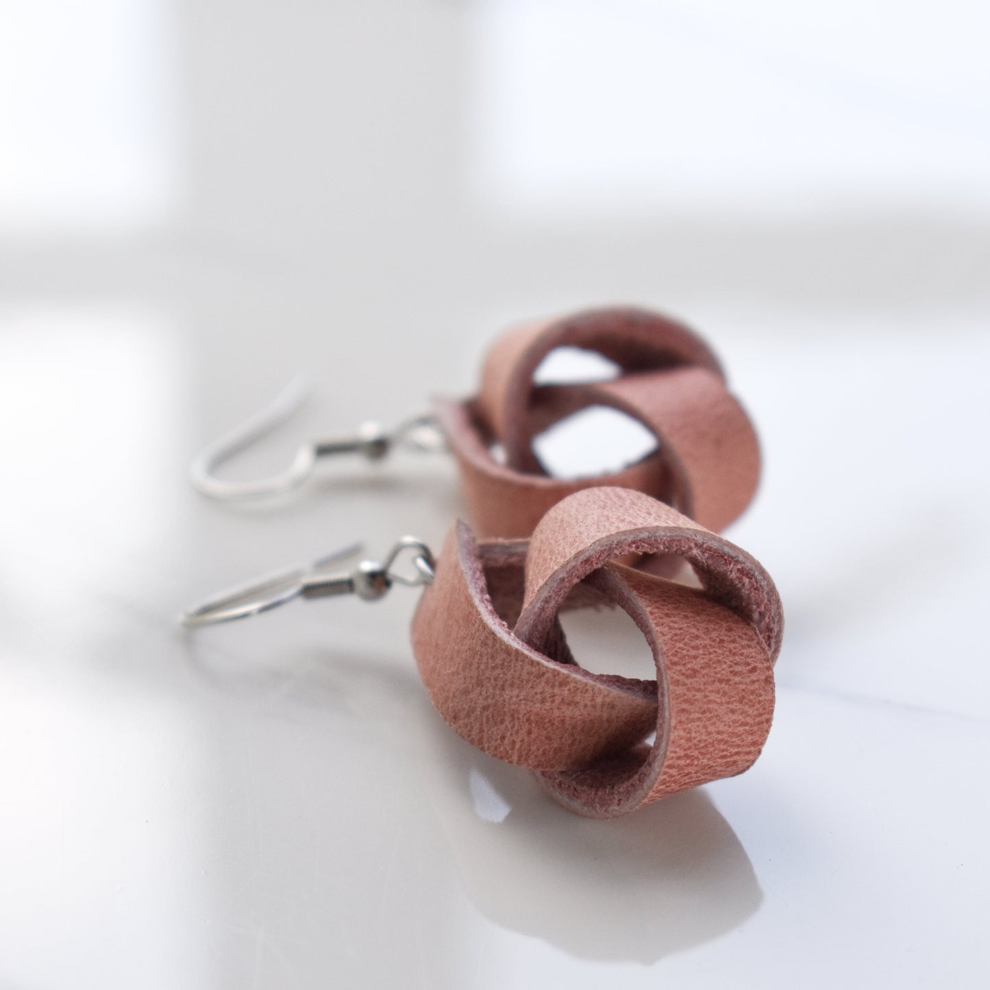 Handmade, light weight and comfortable to wear all day long leather earrings. All our earring hooks are made with a high quality stainless steel and they are hypo allergenic. They will not tarnish or irritate your sensitive skin.