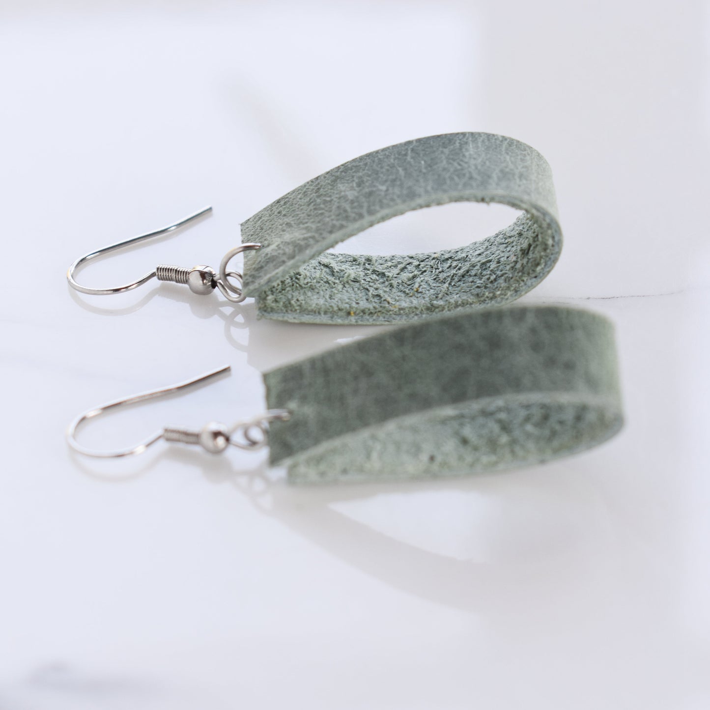 Handmade, light weight and comfortable to wear all day long leather earrings. All our earring hooks are made with a high quality stainless steel and they are hypo allergenic. They will not tarnish or irritate your sensitive skin.