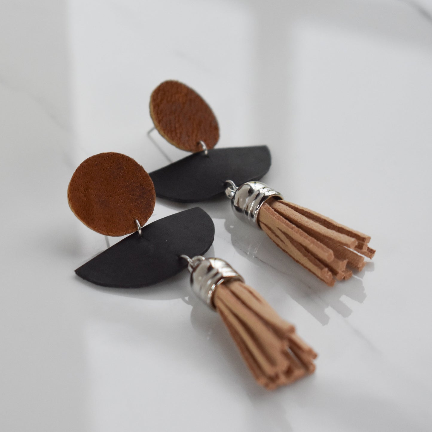 Handmade, light weight and comfortable to wear all day long leather earrings. All our earring hooks are made with a high quality stainless steel and they are hypo allergenic. They will not tarnish or irritate your sensitive skin.