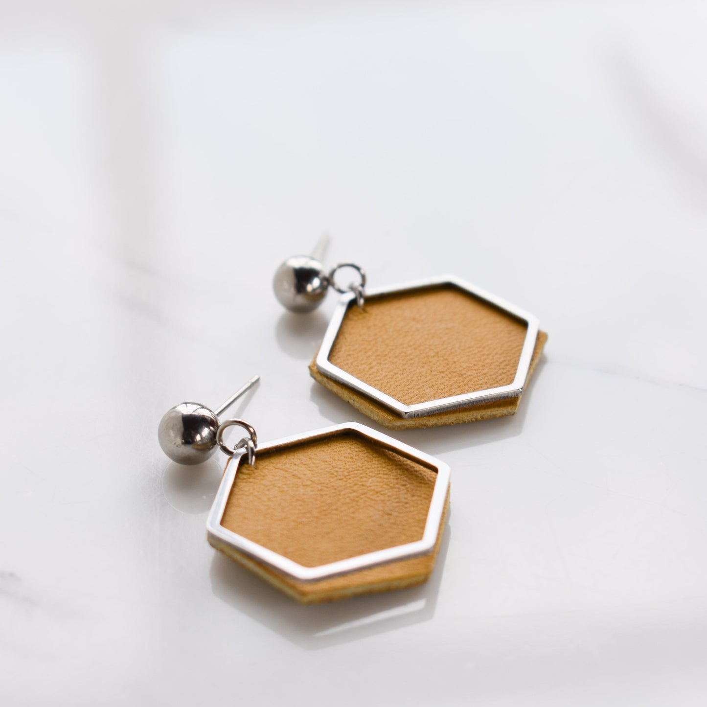 Handmade, light weight and comfortable to wear all day long leather earrings. All our earring hooks are made with a high quality stainless steel and they are hypo allergenic. They will not tarnish or irritate your sensitive skin.