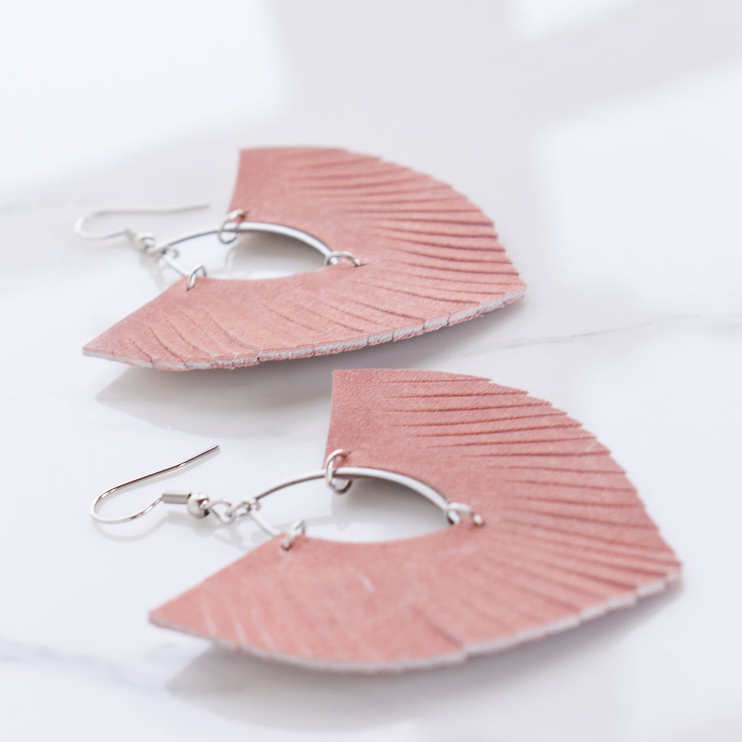 Handmade, light weight and comfortable to wear all day long leather earrings. All our earring hooks are made with a high quality stainless steel and they are hypo allergenic. They will not tarnish or irritate your sensitive skin.