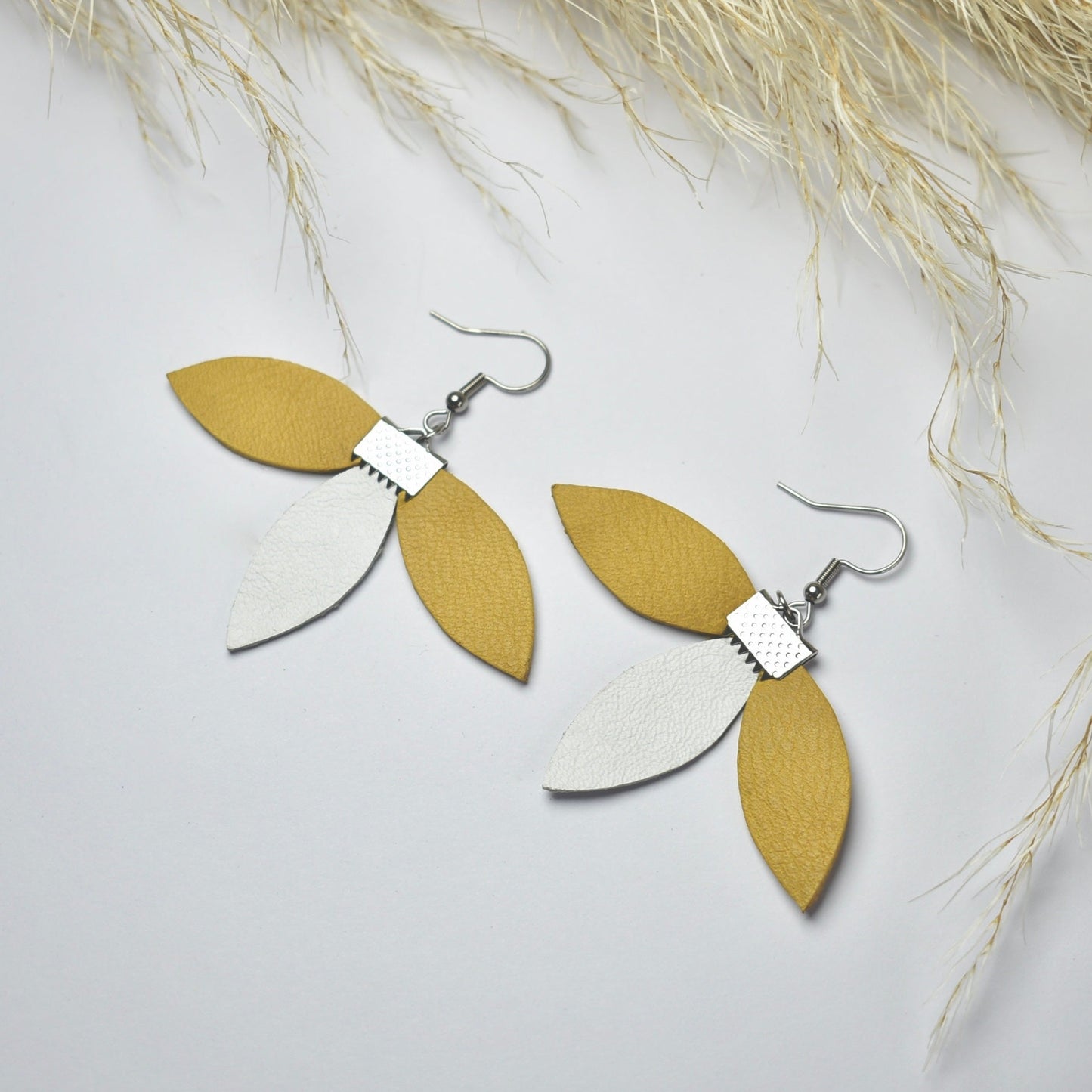 Handmade, light weight and comfortable to wear all day long leather earrings. All our earring hooks are made with a high quality stainless steel and they are hypo allergenic. They will not tarnish or irritate your sensitive skin.