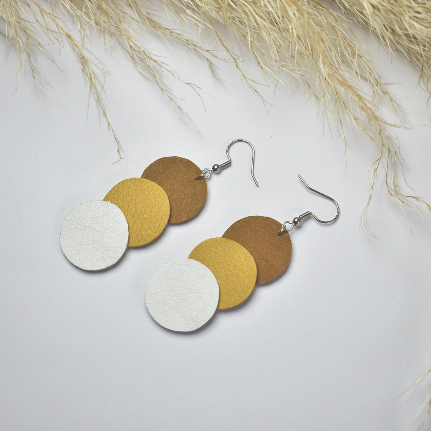 Handmade, light weight and comfortable to wear all day long leather earrings. All our earring hooks are made with a high quality stainless steel and they are hypo allergenic. They will not tarnish or irritate your sensitive skin.