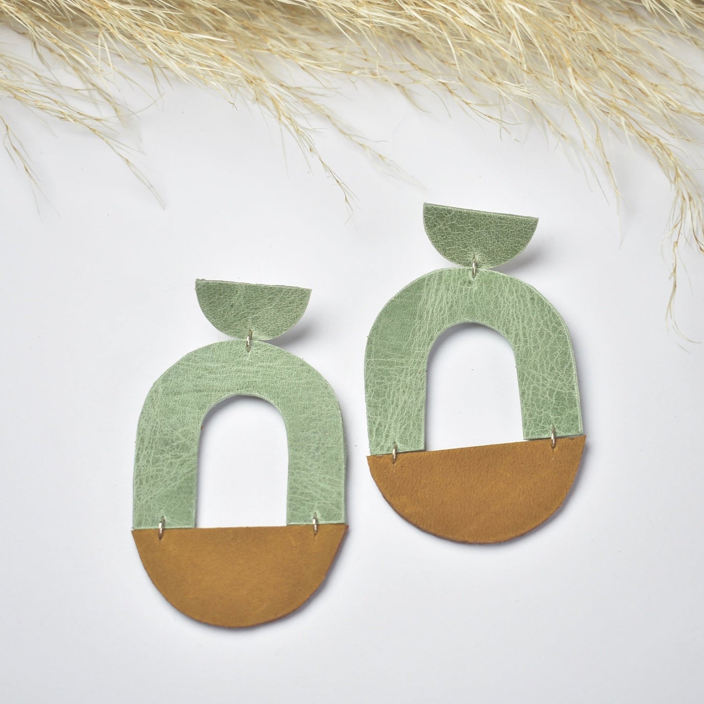 Handmade, light weight and comfortable to wear all day long leather earrings. All our earring hooks are made with a high quality stainless steel and they are hypo allergenic. They will not tarnish or irritate your sensitive skin.