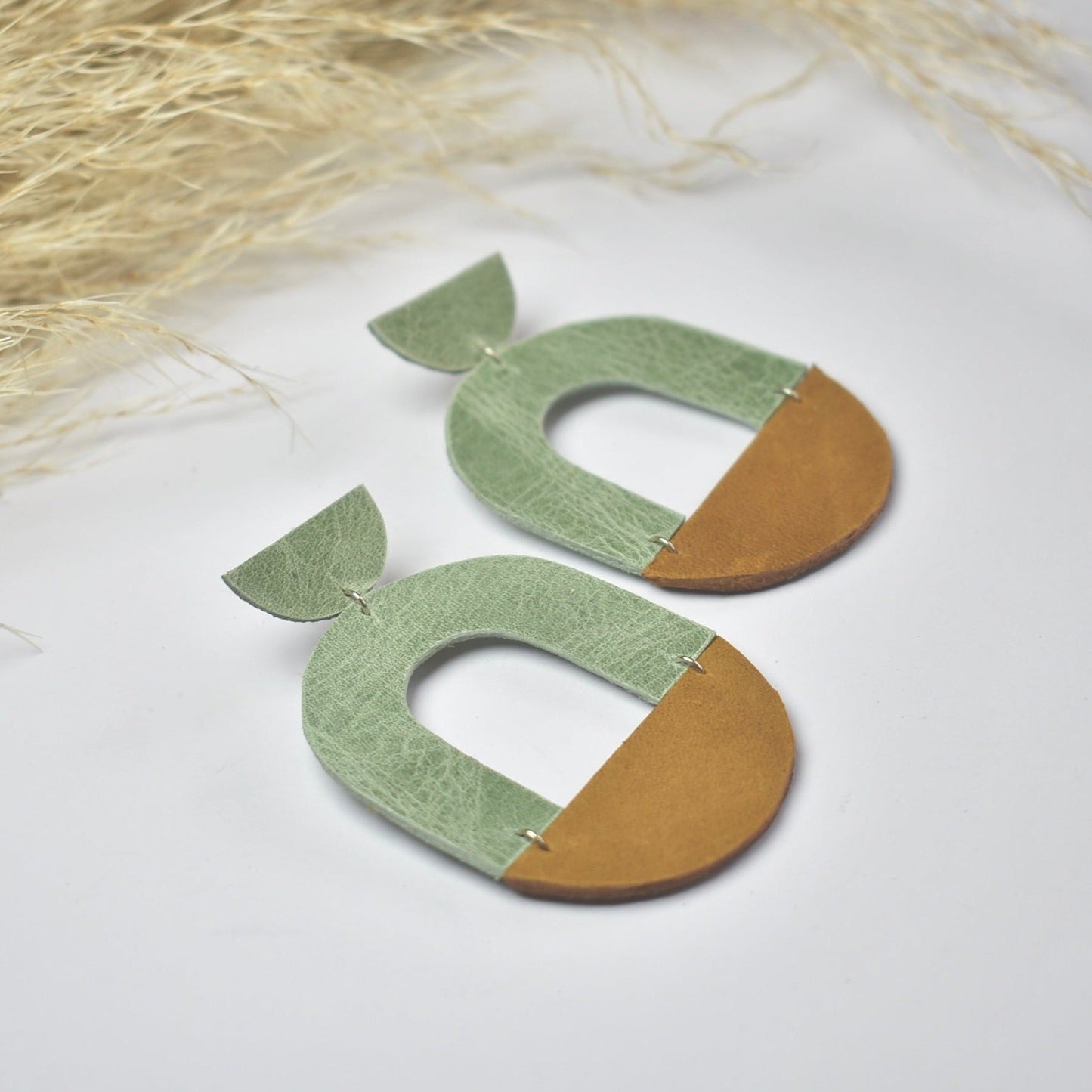 Handmade, light weight and comfortable to wear all day long leather earrings. All our earring hooks are made with a high quality stainless steel and they are hypo allergenic. They will not tarnish or irritate your sensitive skin.