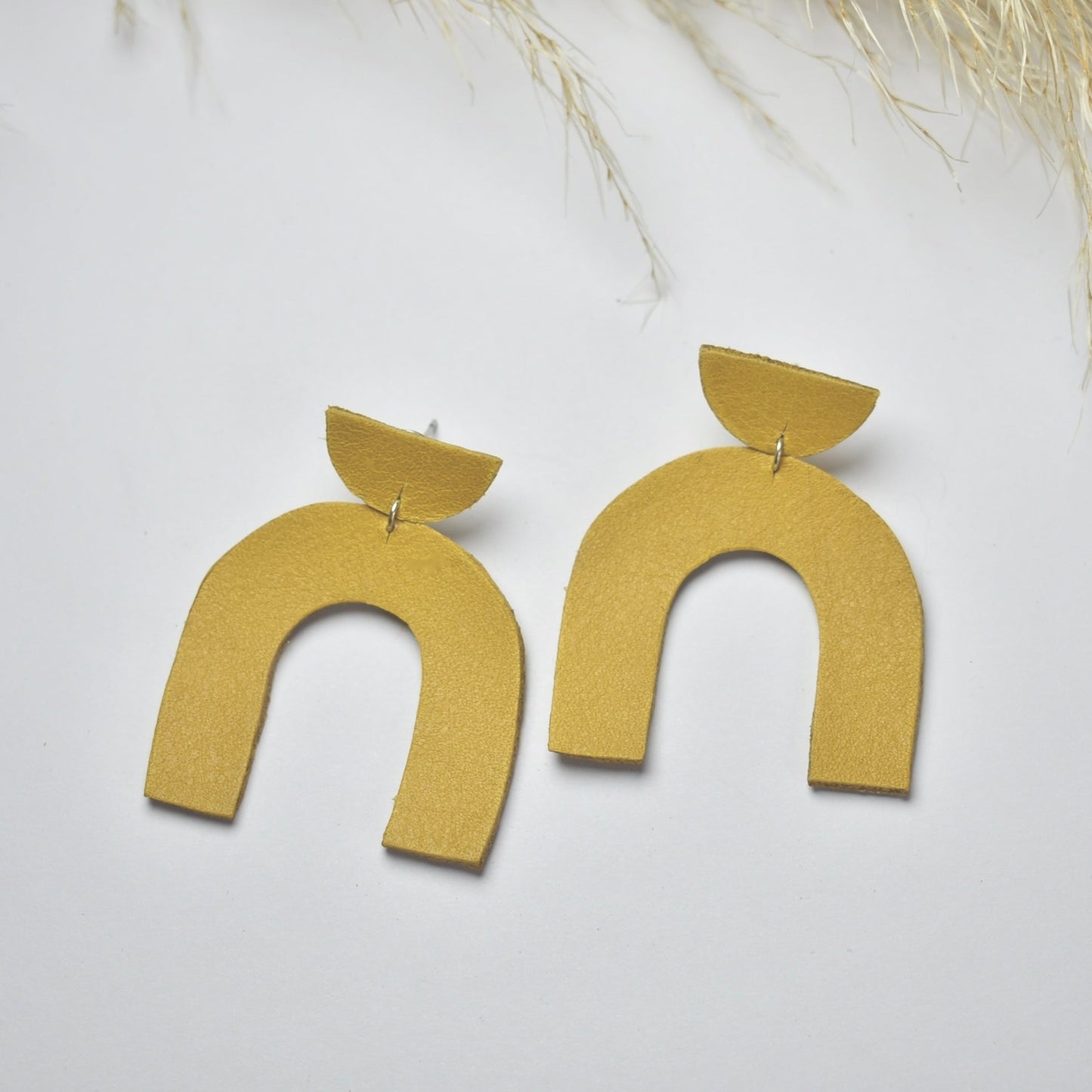 Handmade, light weight and comfortable to wear all day long leather earrings. All our earring hooks are made with a high quality stainless steel and they are hypo allergenic. They will not tarnish or irritate your sensitive skin.