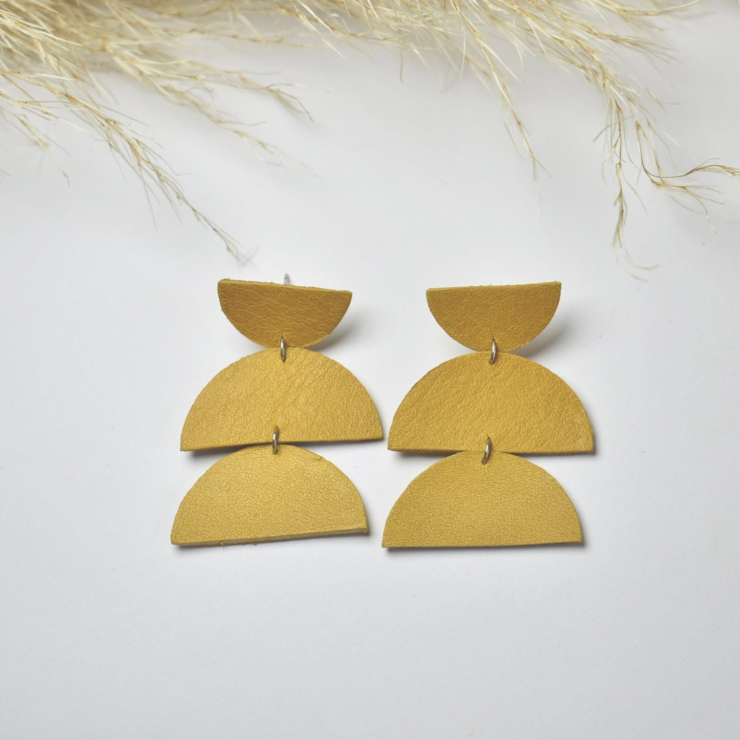 Handmade, light weight and comfortable to wear all day long leather earrings. All our earring hooks are made with a high quality stainless steel and they are hypo allergenic. They will not tarnish or irritate your sensitive skin.