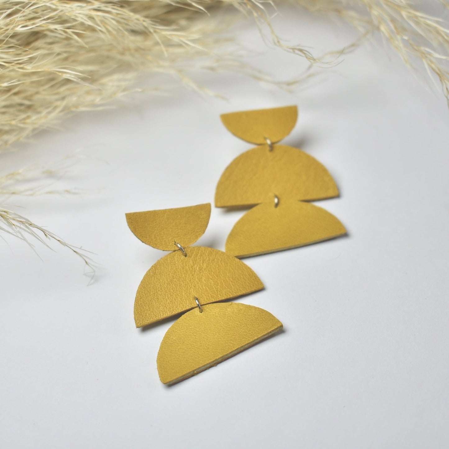 Handmade, light weight and comfortable to wear all day long leather earrings. All our earring hooks are made with a high quality stainless steel and they are hypo allergenic. They will not tarnish or irritate your sensitive skin.