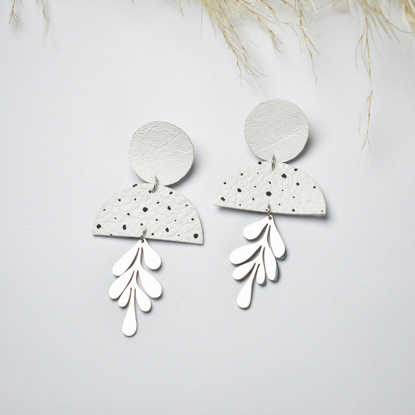 Handmade, light weight and comfortable to wear all day long leather earrings. All our earring hooks are made with a high quality stainless steel and they are hypo allergenic. They will not tarnish or irritate your sensitive skin.