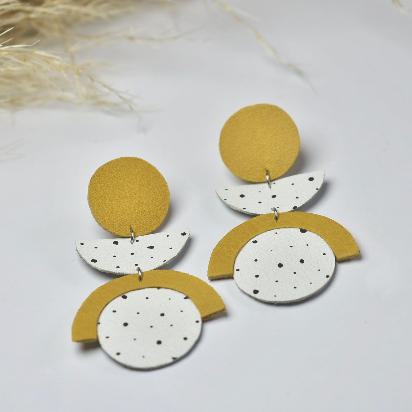 Handmade, light weight and comfortable to wear all day long leather earrings. All our earring hooks are made with a high quality stainless steel and they are hypo allergenic. They will not tarnish or irritate your sensitive skin.