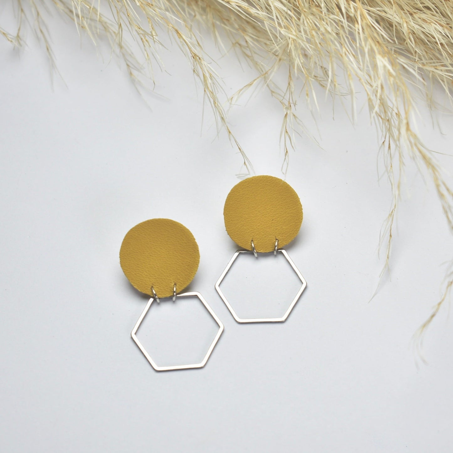 Handmade, light weight and comfortable to wear all day long leather earrings. All our earring hooks are made with a high quality stainless steel and they are hypo allergenic. They will not tarnish or irritate your sensitive skin.