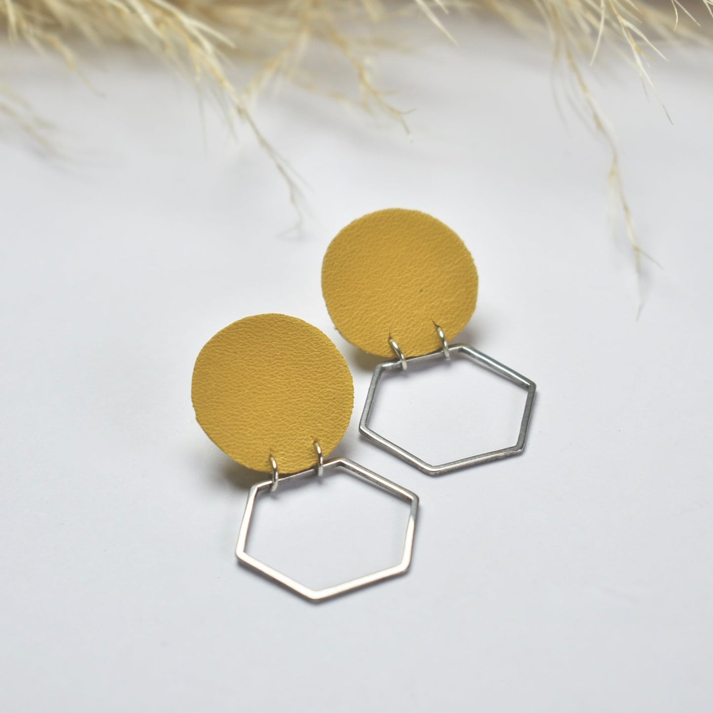 Handmade, light weight and comfortable to wear all day long leather earrings. All our earring hooks are made with a high quality stainless steel and they are hypo allergenic. They will not tarnish or irritate your sensitive skin.