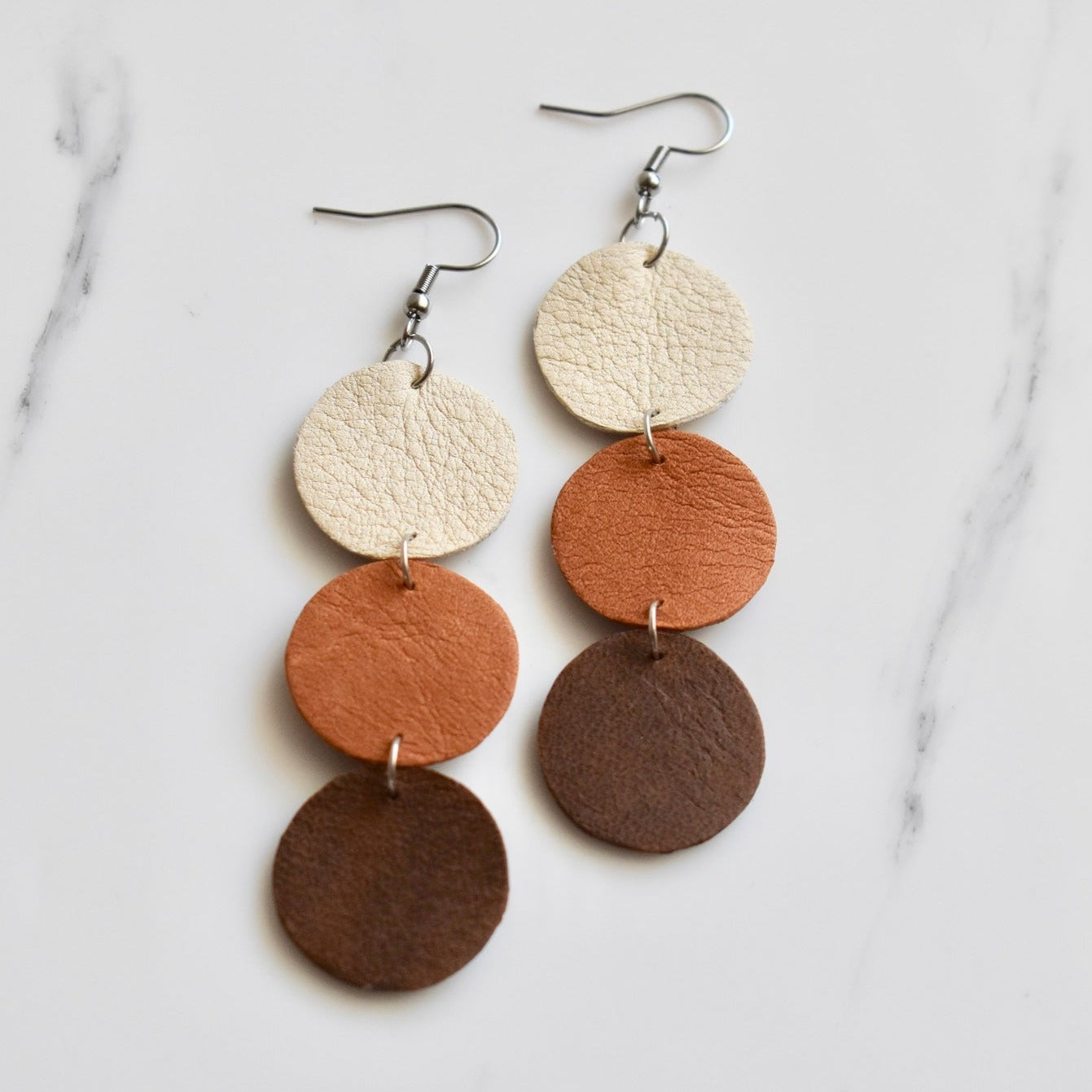 Handmade, light weight and comfortable to wear all day long leather earrings. All our earring hooks are made with a high quality stainless steel and they are hypo allergenic. They will not tarnish or irritate your sensitive skin.