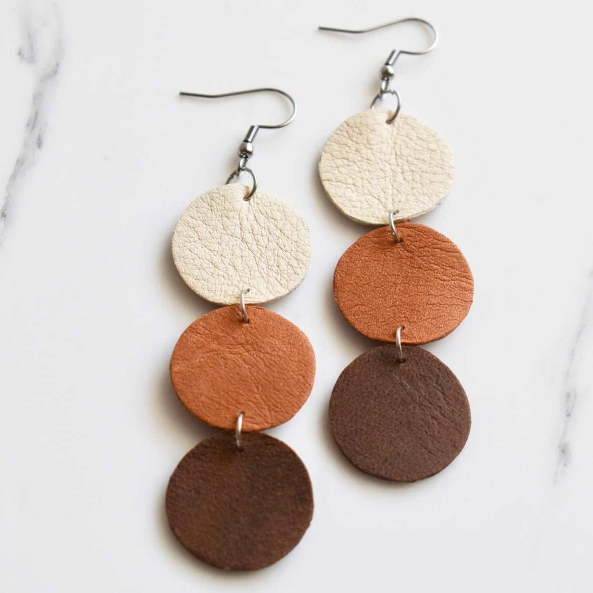 Handmade, light weight and comfortable to wear all day long leather earrings. All our earring hooks are made with a high quality stainless steel and they are hypo allergenic. They will not tarnish or irritate your sensitive skin.