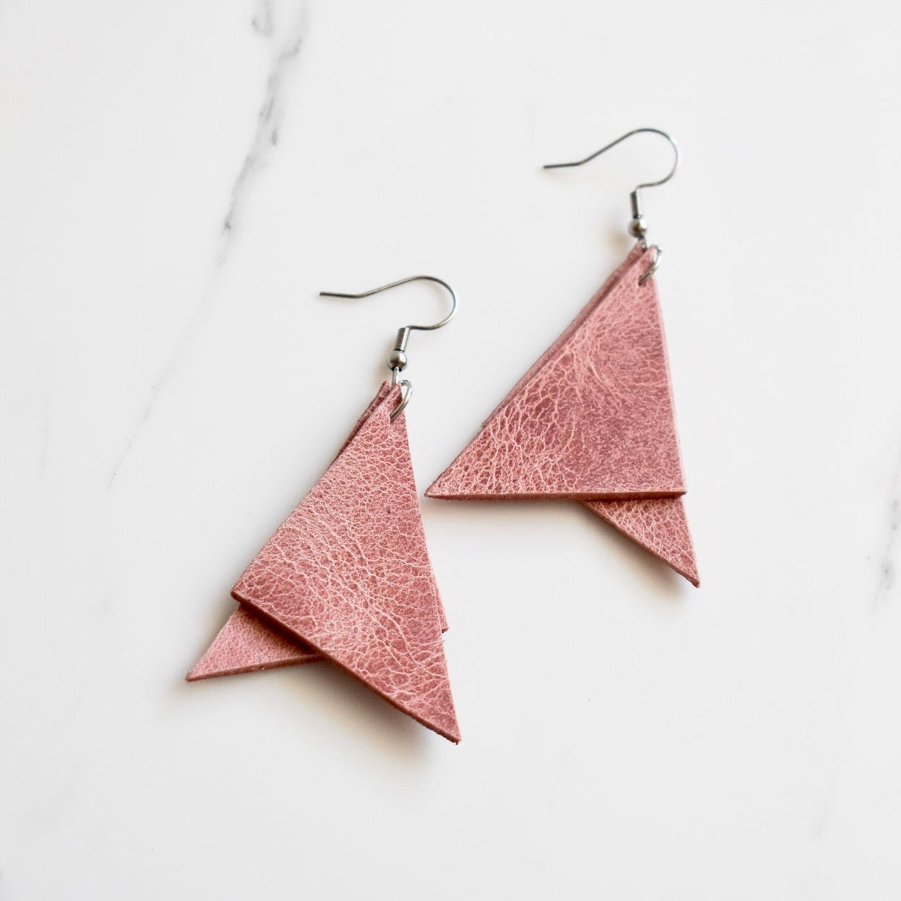 Handmade, light weight and comfortable to wear all day long leather earrings. All our earring hooks are made with a high quality stainless steel and they are hypo allergenic. They will not tarnish or irritate your sensitive skin.
