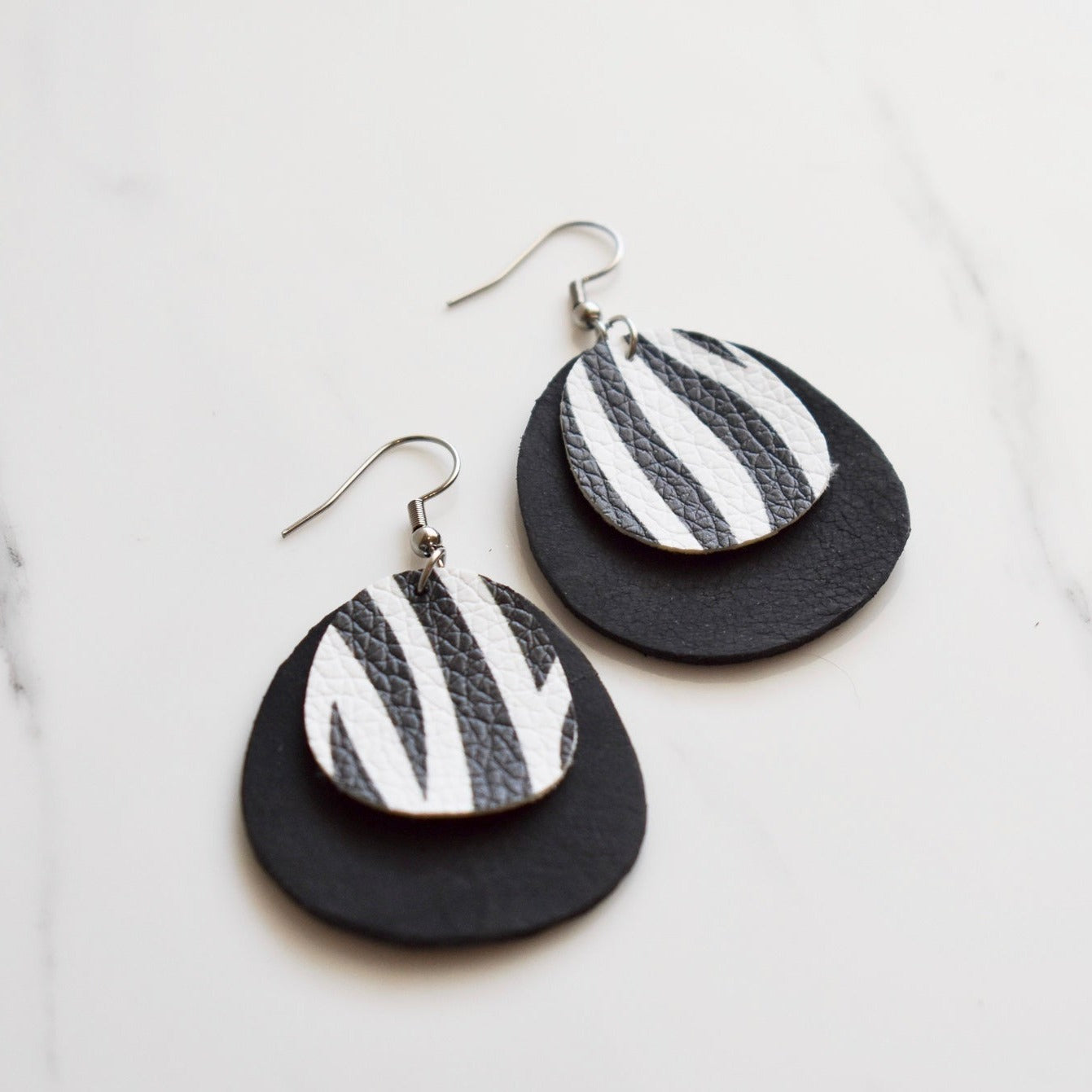 Handmade, light weight and comfortable to wear all day long leather earrings. All our earring hooks are made with a high quality stainless steel and they are hypo allergenic. They will not tarnish or irritate your sensitive skin.