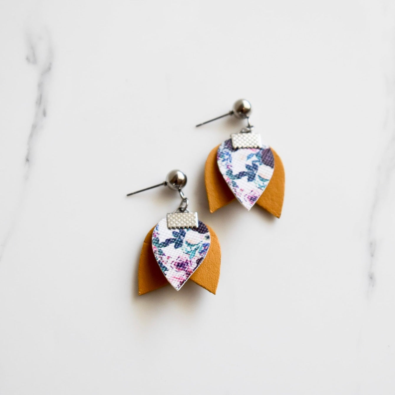 Handmade, light weight and comfortable to wear all day long leather earrings. All our earring hooks are made with a high quality stainless steel and they are hypo allergenic. They will not tarnish or irritate your sensitive skin.