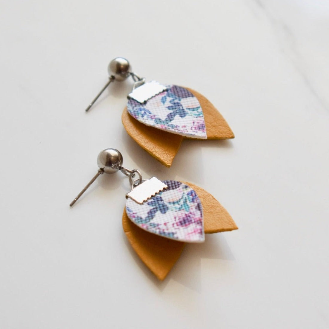 Handmade, light weight and comfortable to wear all day long leather earrings. All our earring hooks are made with a high quality stainless steel and they are hypo allergenic. They will not tarnish or irritate your sensitive skin.