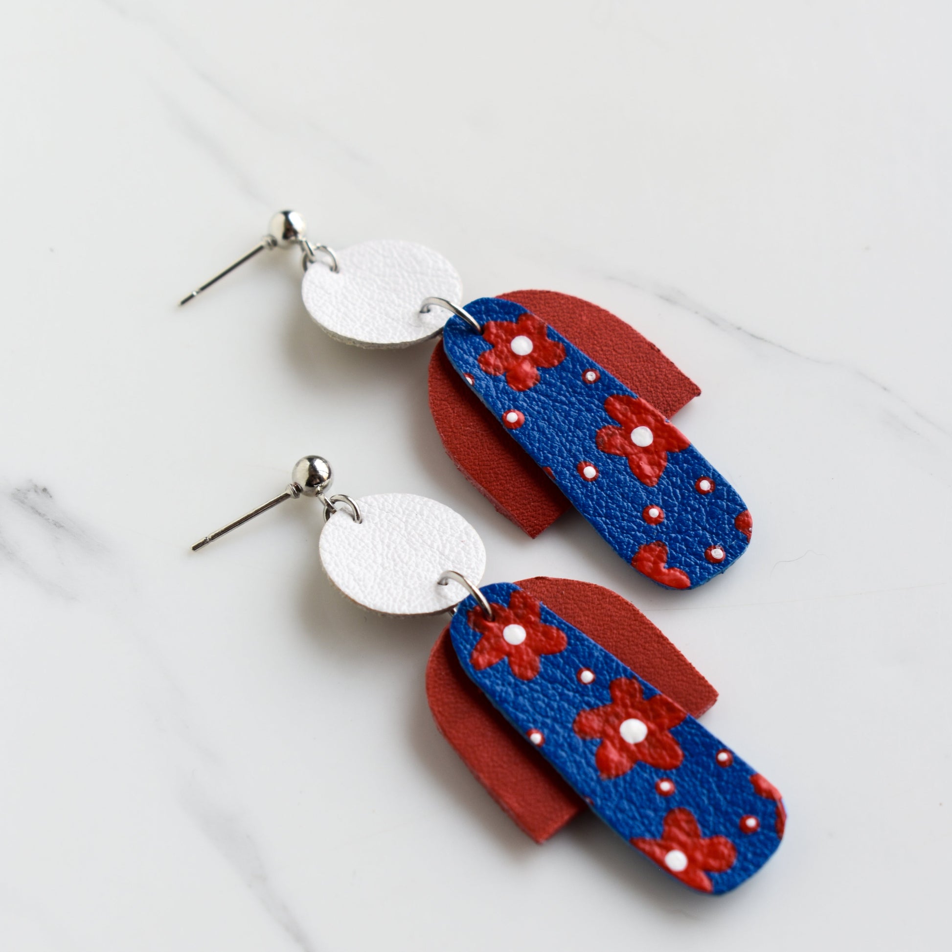 Hand painted and handmade, light weight and comfortable to wear all day long leather earrings. All our earring hooks are made with a high quality stainless steel and they are hypo allergenic. &nbsp;They will not tarnish or irritate your sensitive skin.


