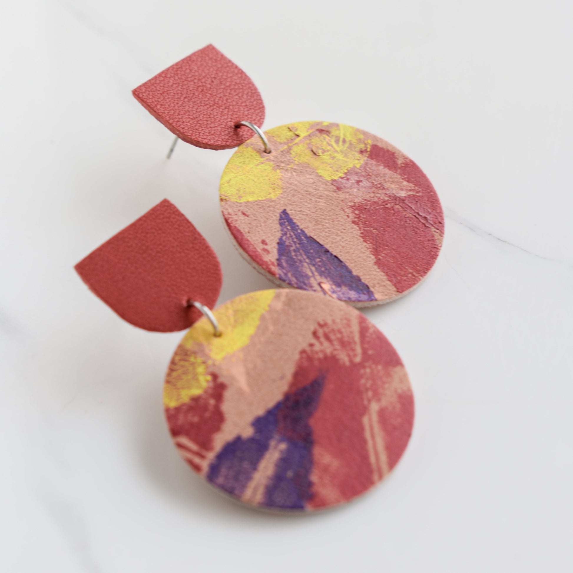 Hand painted and handmade, light weight and comfortable to wear all day long leather earrings. All our earring hooks are made with a high quality stainless steel and they are hypo allergenic. &nbsp;They will not tarnish or irritate your sensitive skin.

