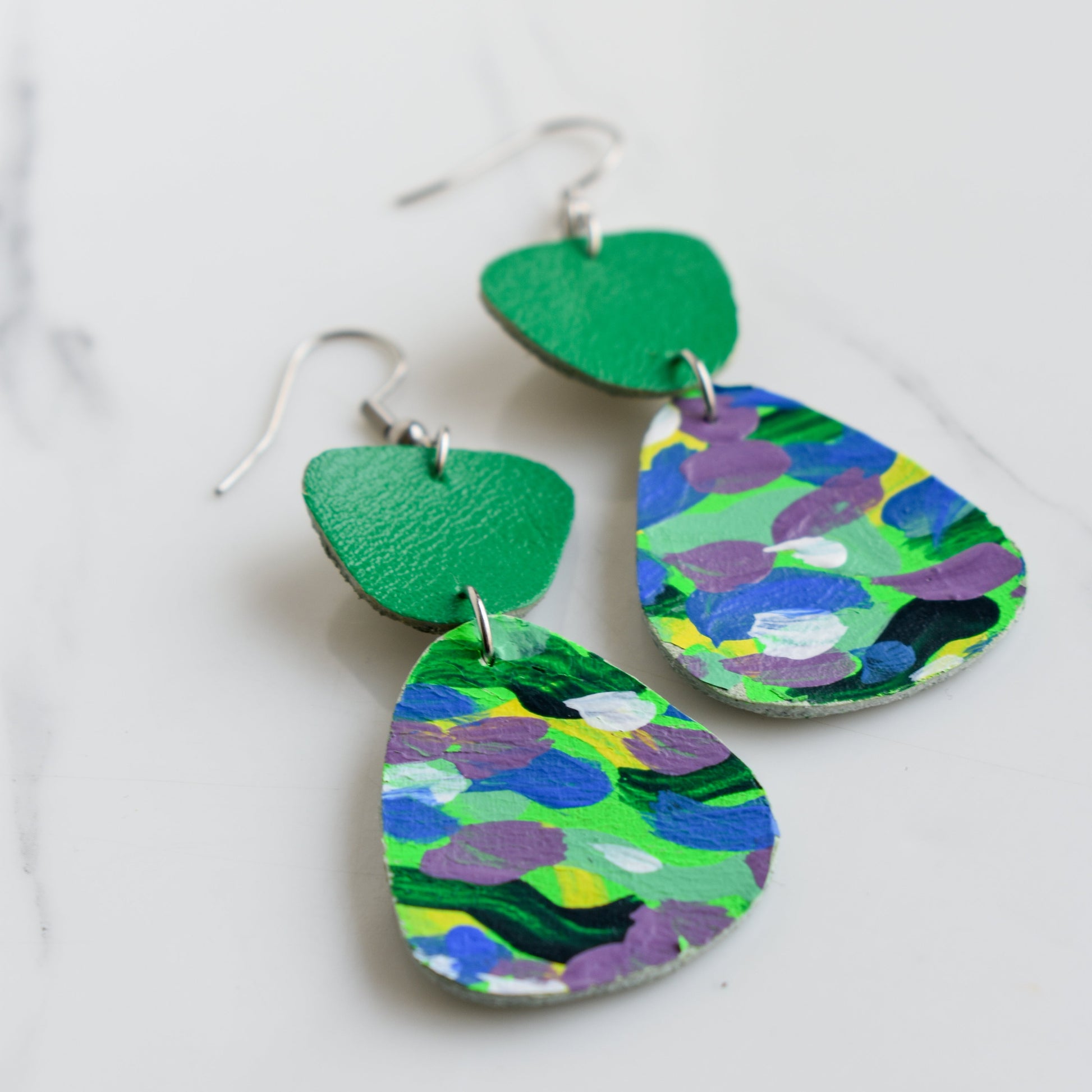 Hand painted and handmade, light weight and comfortable to wear all day long leather earrings. All our earring hooks are made with a high quality stainless steel and they are hypo allergenic. &nbsp;They will not tarnish or irritate your sensitive skin.


