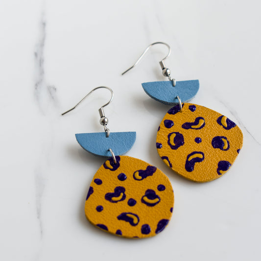 Hand painted and handmade, light weight and comfortable to wear all day long leather earrings. All our earring hooks are made with a high quality stainless steel and they are hypo allergenic. &nbsp;They will not tarnish or irritate your sensitive skin.

