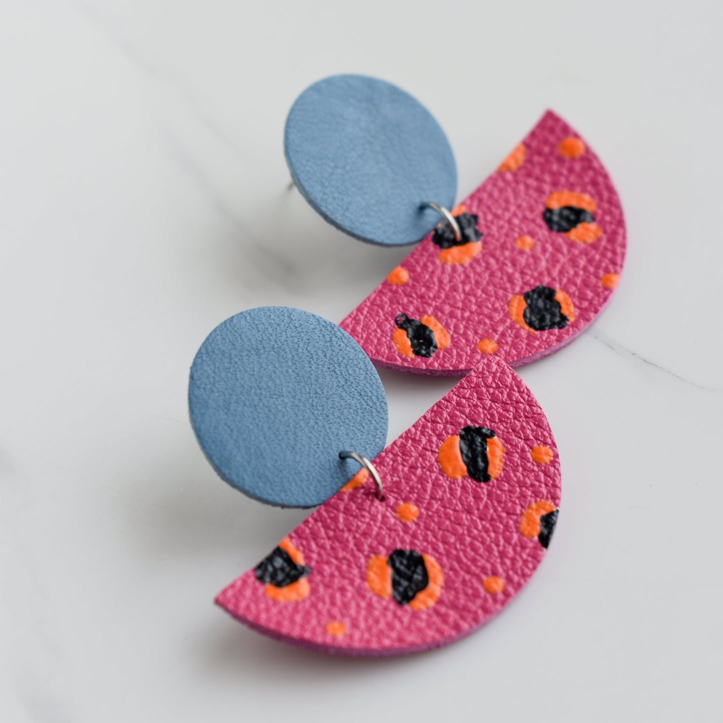 Hand painted and handmade, light weight and comfortable to wear all day long leather earrings. All our earring hooks are made with a high quality stainless steel and they are hypo allergenic. &nbsp;They will not tarnish or irritate your sensitive skin.


