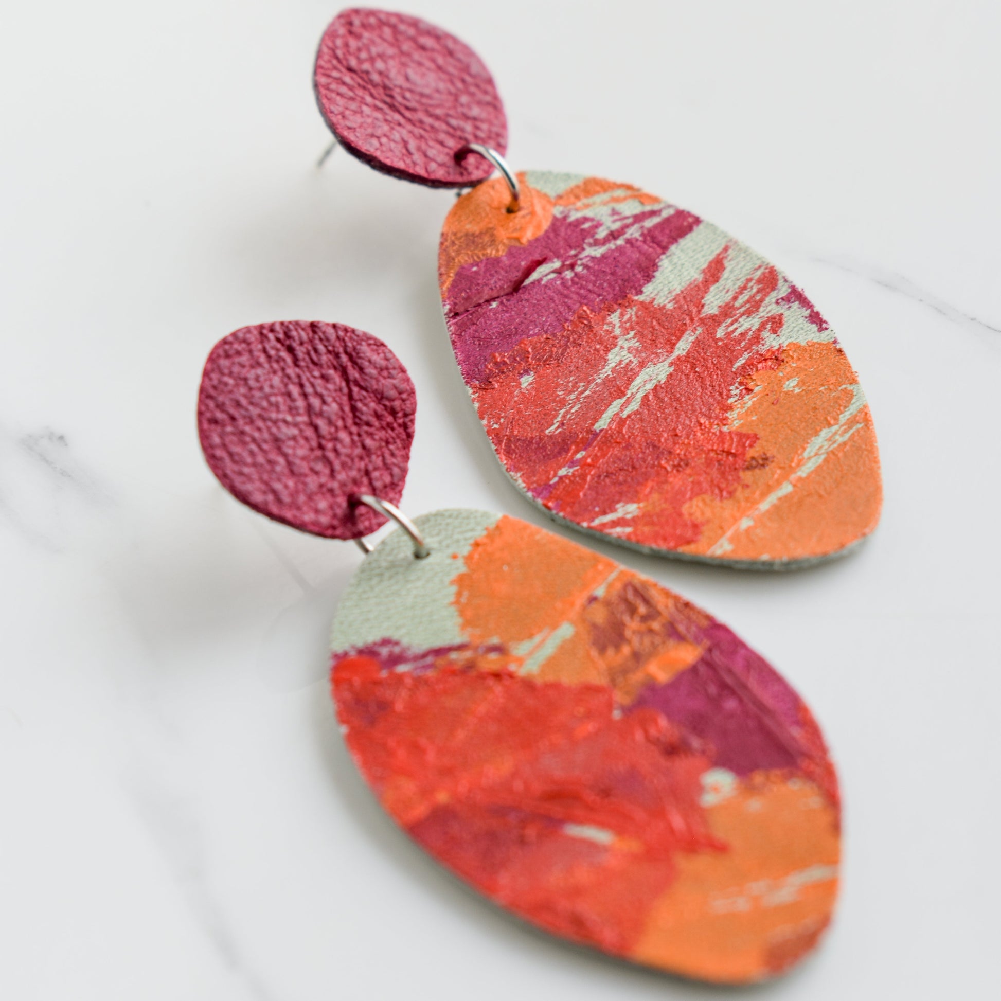 Hand painted and handmade, light weight and comfortable to wear all day long leather earrings. All our earring hooks are made with a high quality stainless steel and they are hypo allergenic. &nbsp;They will not tarnish or irritate your sensitive skin.

