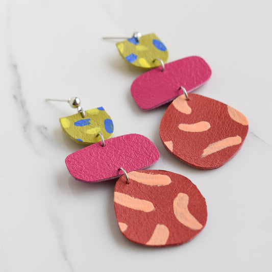 Hand painted and handmade, light weight and comfortable to wear all day long leather earrings. All our earring hooks are made with a high quality stainless steel and they are hypo allergenic. &nbsp;They will not tarnish or irritate your sensitive skin.

